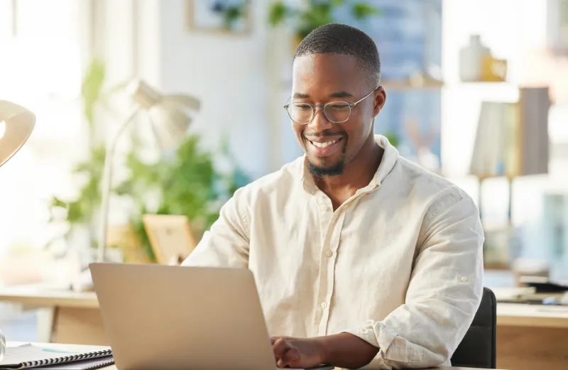 shot of a young businessman working on his laptop at his desk