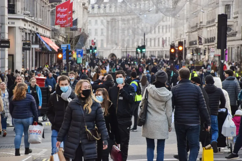 london, united kingdom - december 5 2020  people wearing protective face masks walking on regent street, which was closed to vehicle traffic for a day