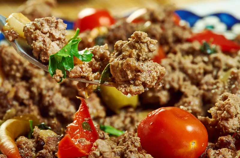 veal axoa typical basque dish prepared with mashed veal, onions, tomatoes sauté and flavoured with red espelette pepper