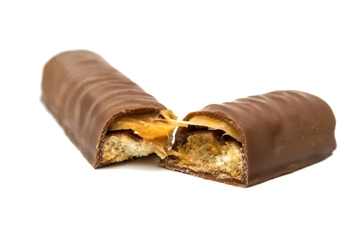 chocolate bar (nougat topped with caramel enrobed in milk chocolate) isolated on white background