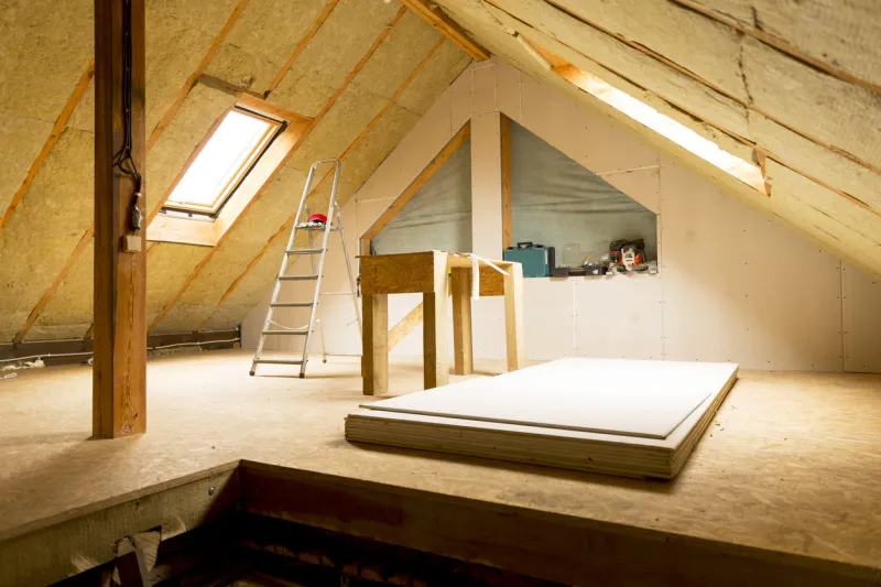 house attic under construction mansard wall insulation with rock wool