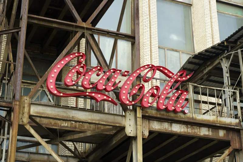 new york, usa - july 15, 2022  old vintage sign of coca-cola drink on the facade of the building retro, design, style concept high quality photo