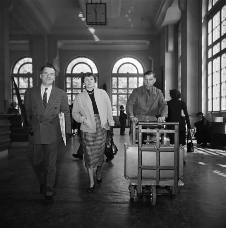 a couple who is about to take a plane is walking in the invalides terminal on june 21, 1949 in paris (photo by -   afp)