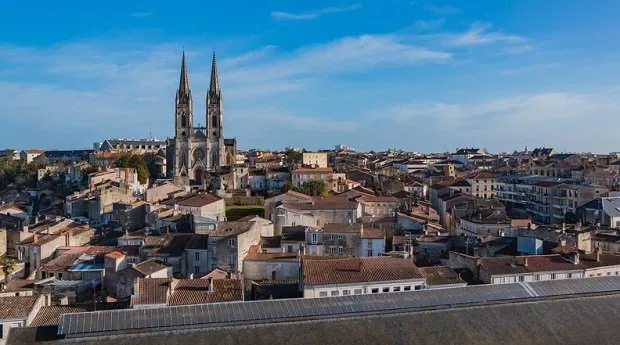 a cityscape of niort with the saint andré church on the left