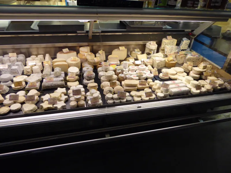 cheese stall at a farmer's market in france