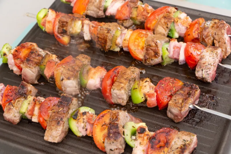 beef and vegetables brochette on plancha grill