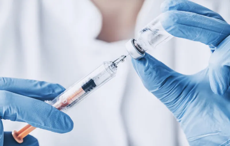 injecting injection vaccine vaccination medicine flu man doctor insulin health drug influenza concept - stock image