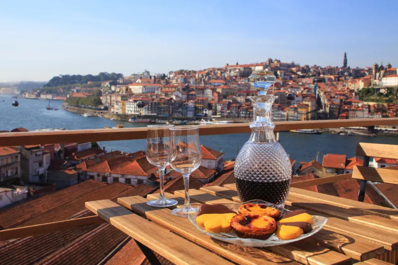 table with view a wonderful view over the river in porto, portugal