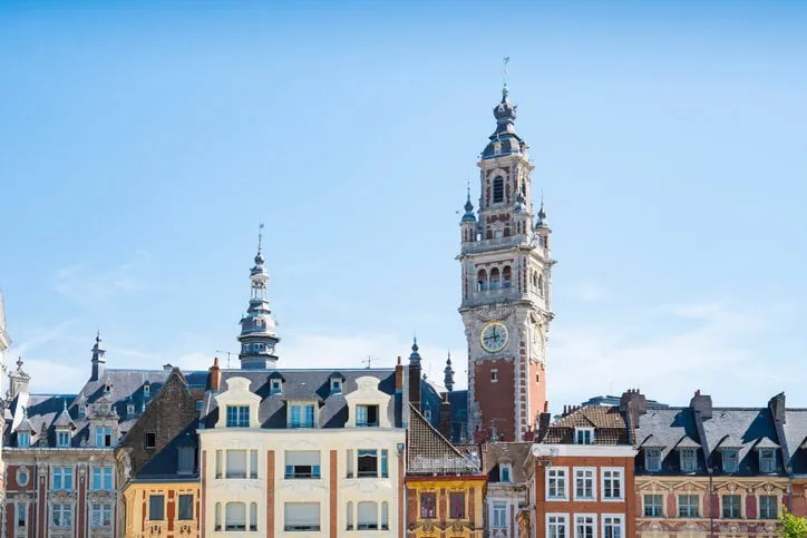 tower of chamber of commerce, buildings at central town square in lille, france