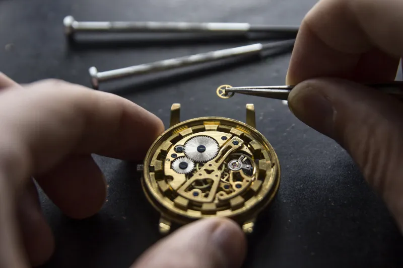 process of installing a part on a mechanical watch, watch repair