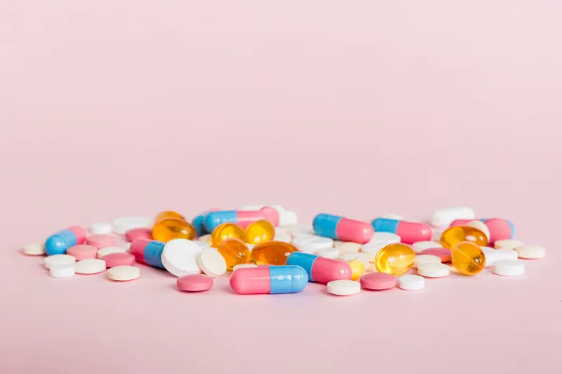 many different colorful medication and pills perspective view set of many pills on colored background
