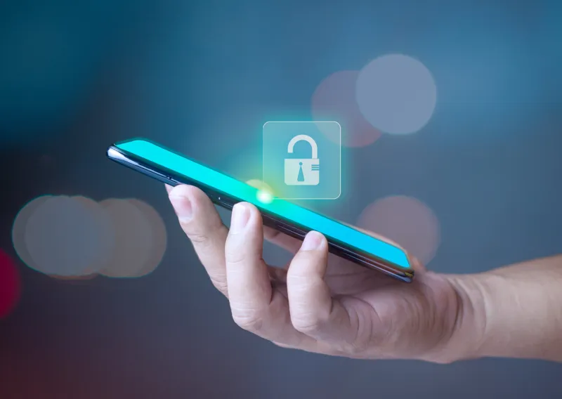 hand holding phone and key icon represents protection against external hacks, code protection security concepts, viruses, firmware and malware