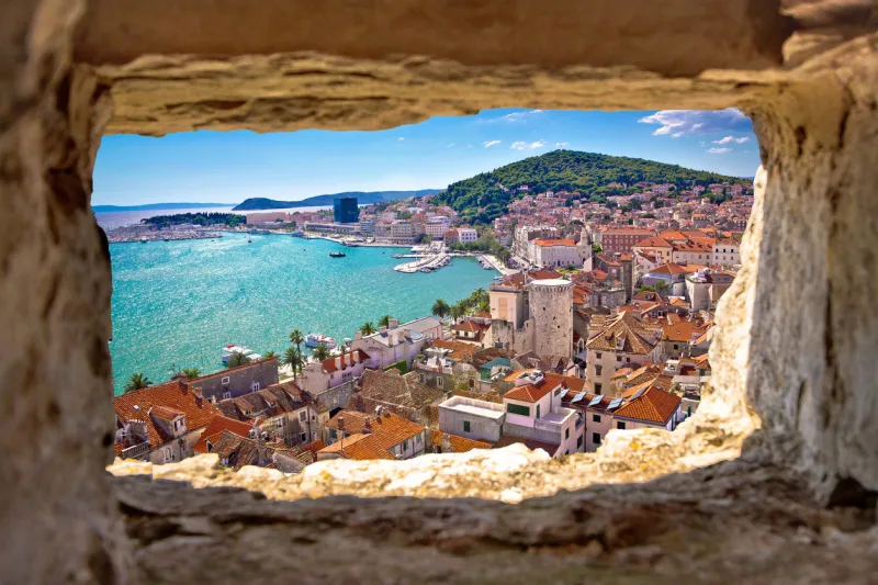 split bay aerial view through stone window, dalmatia, croatia