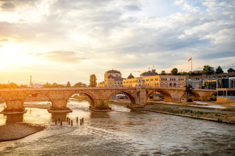 view on stone bridge from oko bridge in skopje on sunset