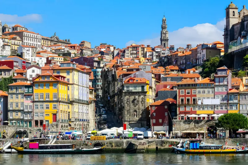 cityscape of the city of porto, douro river with its old boat and its typical colored houses on the water's edge portugal europe