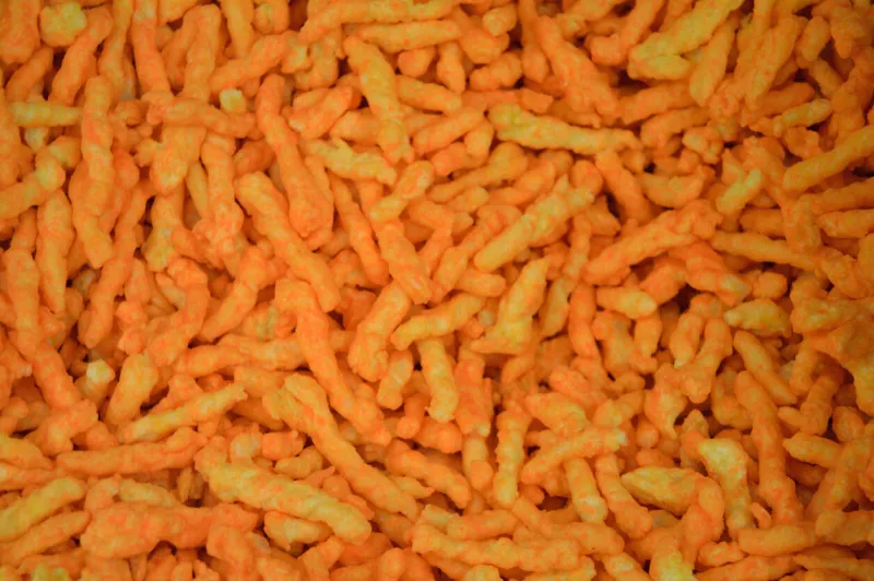 shots of crunchy cheese puffs close up