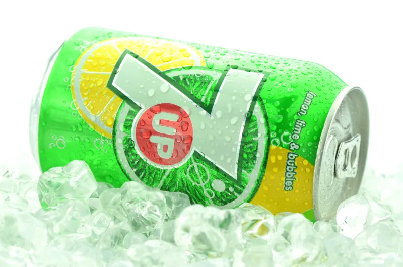 kwidzyn, poland - march 31, 2014  can of 7 up drink in ice isolated on white 7 up is lemon-lime flavored drink 7 up was created by charles leiper grigg in