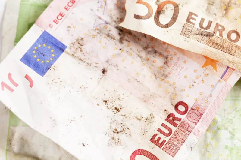 close up of crinkled and dirty euro notes
