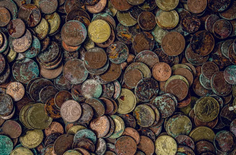 corroding coins - money depreciation - inflation, reduced value