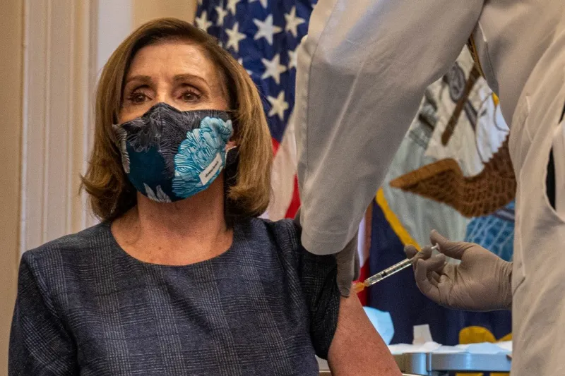 speaker of the house nancy pelosi (d-ca) receives a covid-19 vaccination shot by doctor brian monahan, attending physician congress of the united states in her office in washington, dc on december 18, 2020 (photo by ken cedeno   pool   afp)