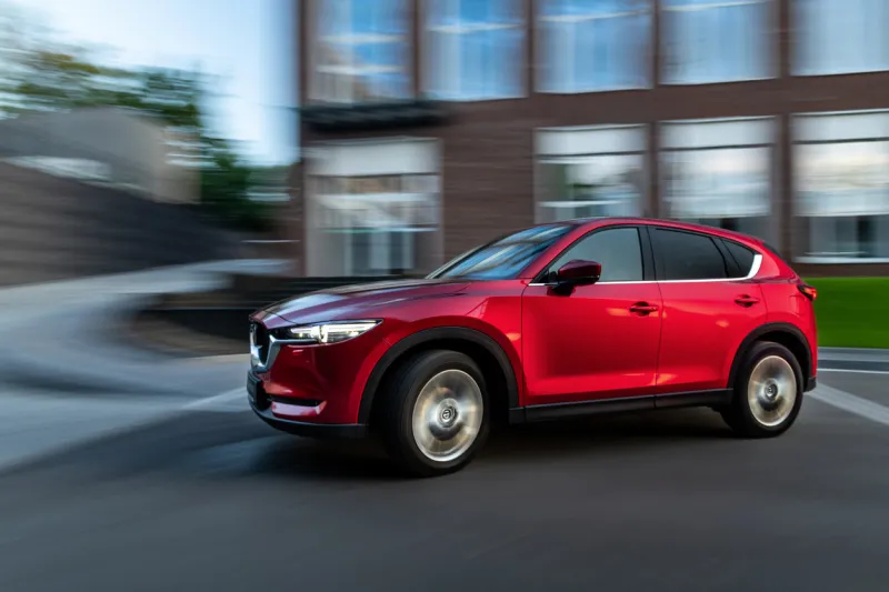 kyiv, ukraine - june 30, 2021  red mazda cx-5 in motion in the city