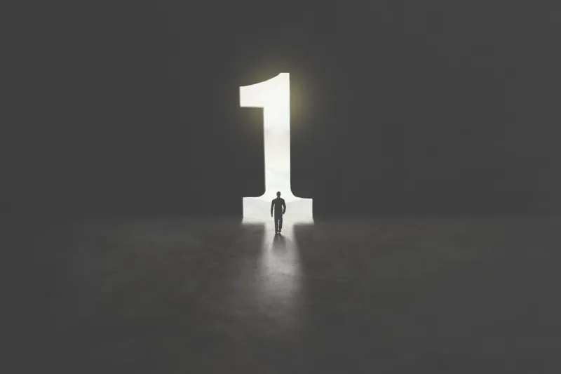 serie of images representing a business man in silhouette walking trough different shaped door in concrete wall