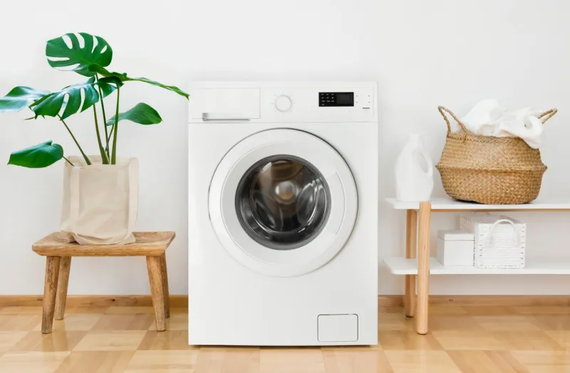 clothes washing machine in laundry room interior