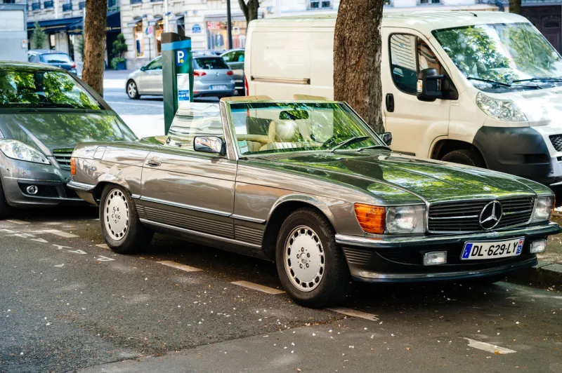 paris  vintage mercedes-benz sl convertible car parked on paris street with opened roof-top