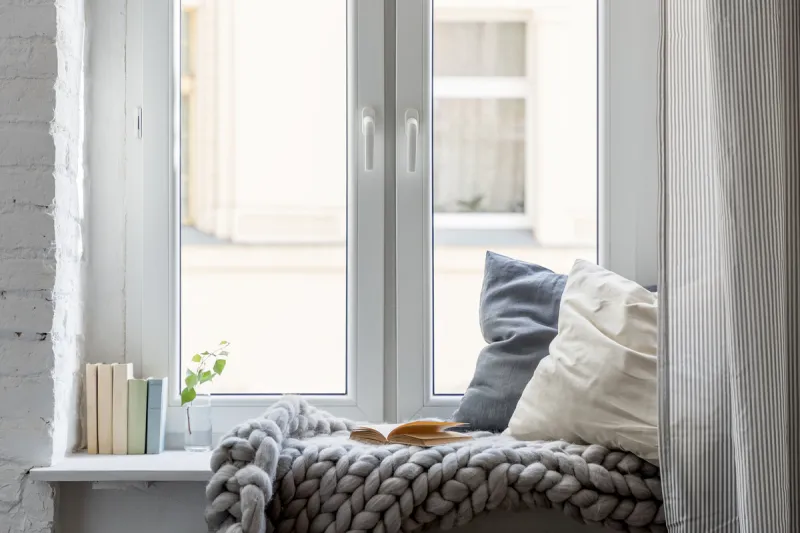home interior with cozy leisure area beside window