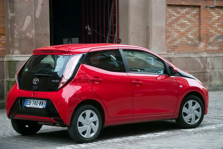 colmar - france - 21 may 2021 - rear view of red toyota aygo parked in the street