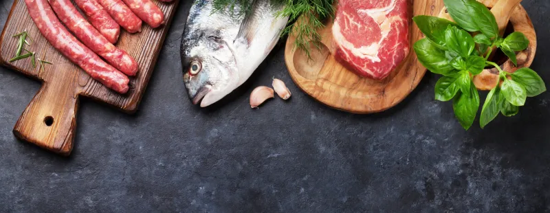 sausages, fish, meat and ingredients cooking top view flat lay