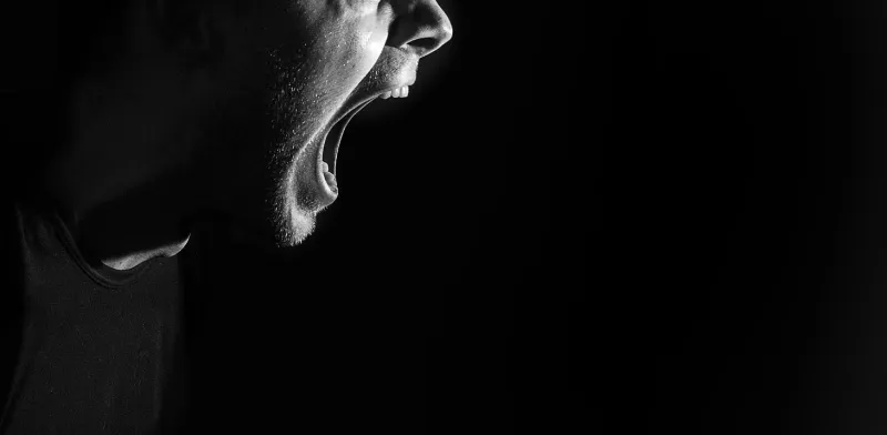 screaming angry aggressive militant guy, man, black and white portrait, evil face, teeth