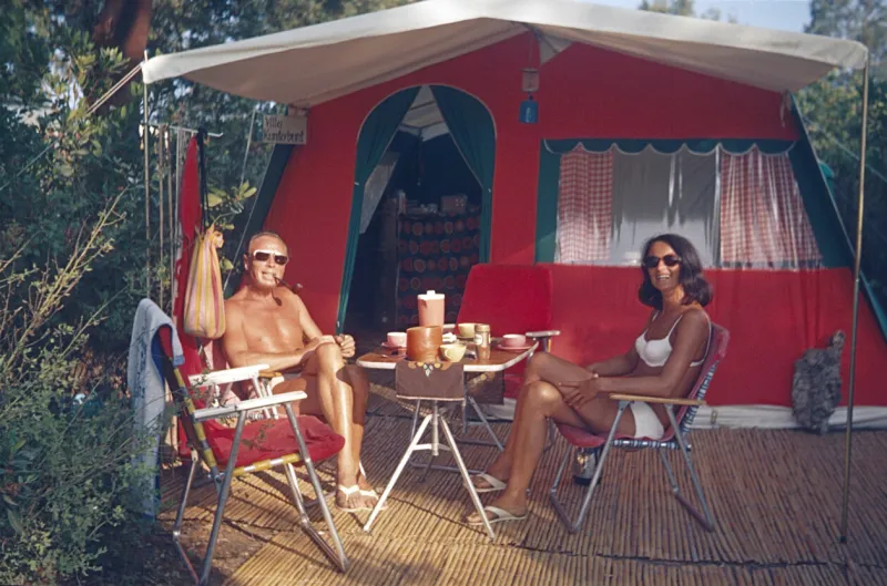 provence, southern france, 1970 a couple enjoys their camping holiday over a cup of coffee on the côte d'azur