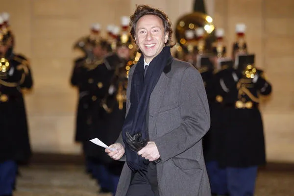 l'hôte de télévision français stéphane bern sourit alors qu'il arrive pour un dîner d'État avec le roi et la reine de suède au palais présidentiel d'elysée à paris le 2 décembre 2014 afp photo matthieu alexandre afp photo matthieu alexandre