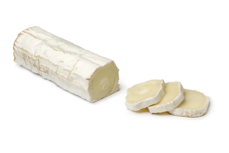 traditional french goats cheese and slices isolated on white background