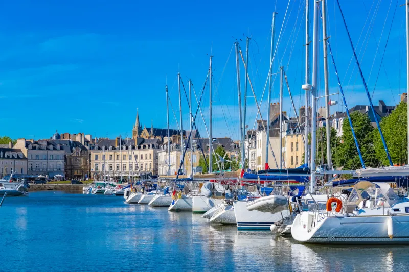vannes harbor, in the morbihan, brittany, boats in the marina, with typical houses and the cathedral in background