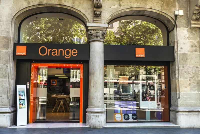 barcelona, spain - may 4, 2016  orange shop located on passeig de gracia, one of the most expensive streets in europe