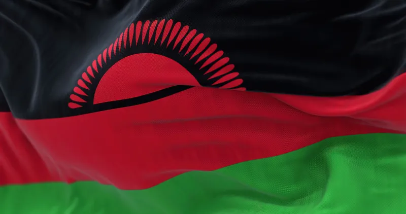 close-up view of malawi national flag waving the republic of malawi is a landlocked country in southeastern africa fabric textured background selective focus 3d illustration render