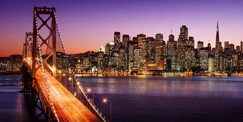 san francisco skyline and bay bridge at sunset, california