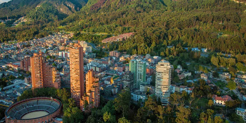 a view of the center of bogota with the andes in the background