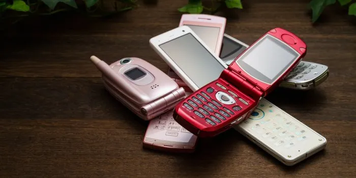 old used cell phone on white background