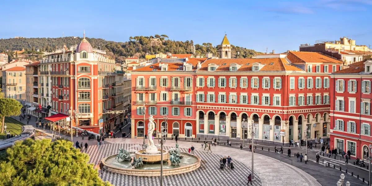 aerial view of place massena square with red buildings and fountain in nice, france