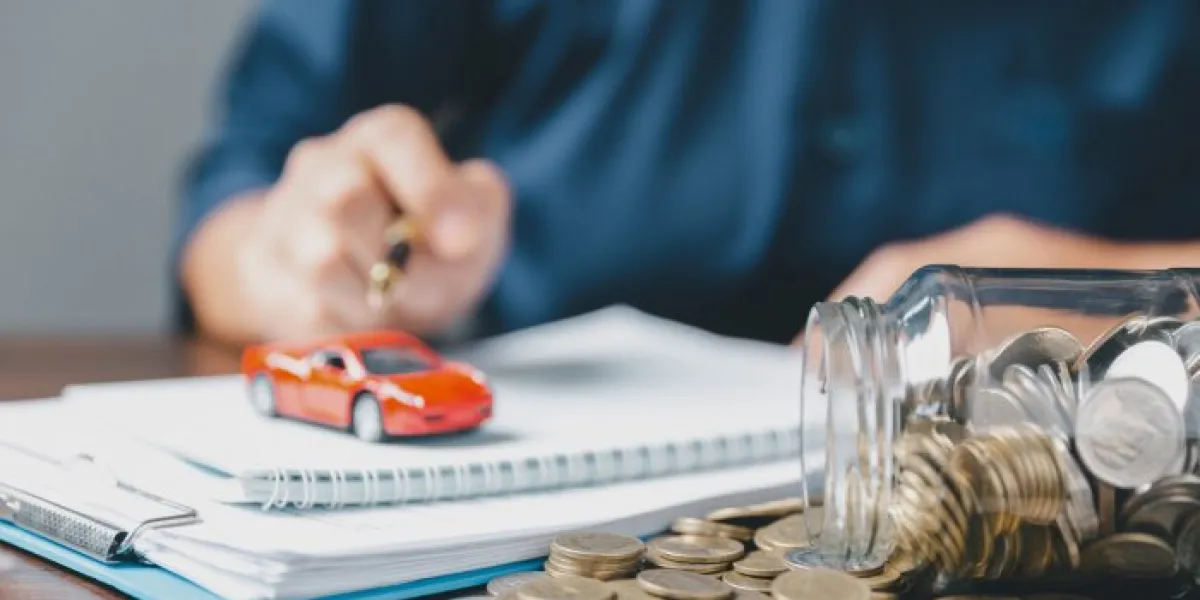 concept of car insurance business, saving buy - sale with tax and loan for new car car toy vehicle with stack coin money on background planning to manage transportation finance costs loan for car
