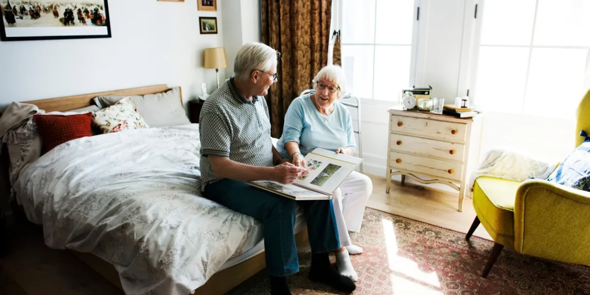 senior couple looking at family photo albumdocumentation proving the source is available in the public domain