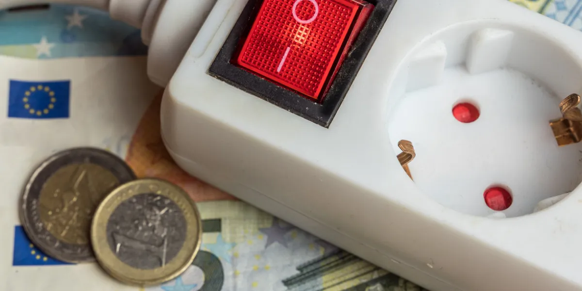 a power plug and many euro bills