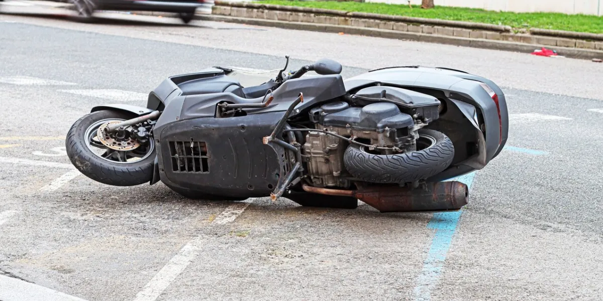 a motorbike lying on a street