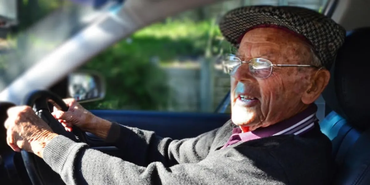 a very old man with a valid driving license drives a car