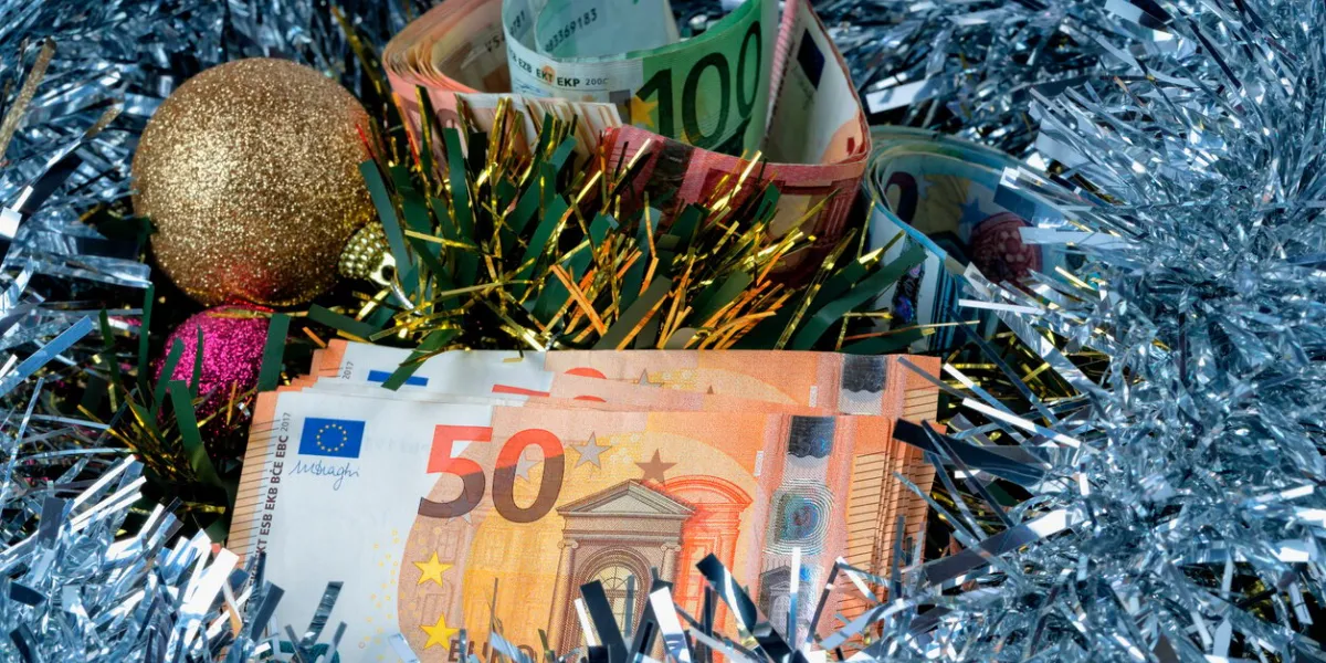 a lot of euro bills with colorful christmas decorations