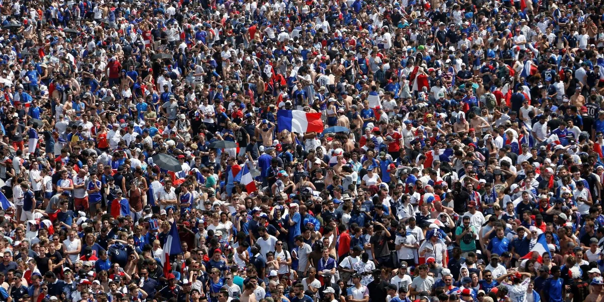 france supporters wave french flags as they gather on the fan zone to watch the russia 2018 world cup final football match between france and croatia, on the champ de mars in paris on july 15, 2018   afp photo   charly triballeau