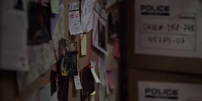 investigation board with pinned photos, newspapers and notes, solving crime